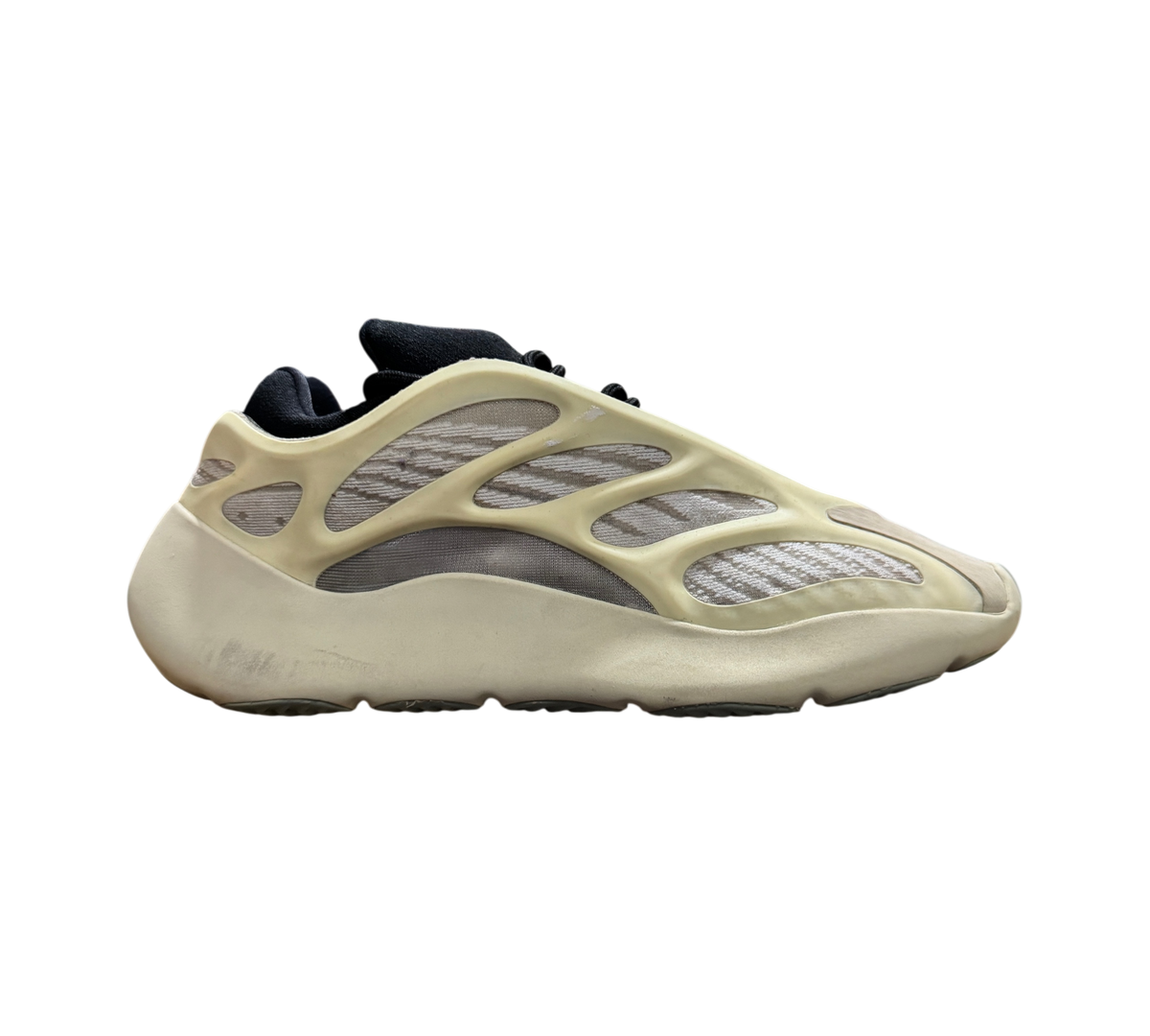 Genesis Boutique used Yeezy 700 Azael sneakers featuring a cream-colored cage overlay and black interior lining.