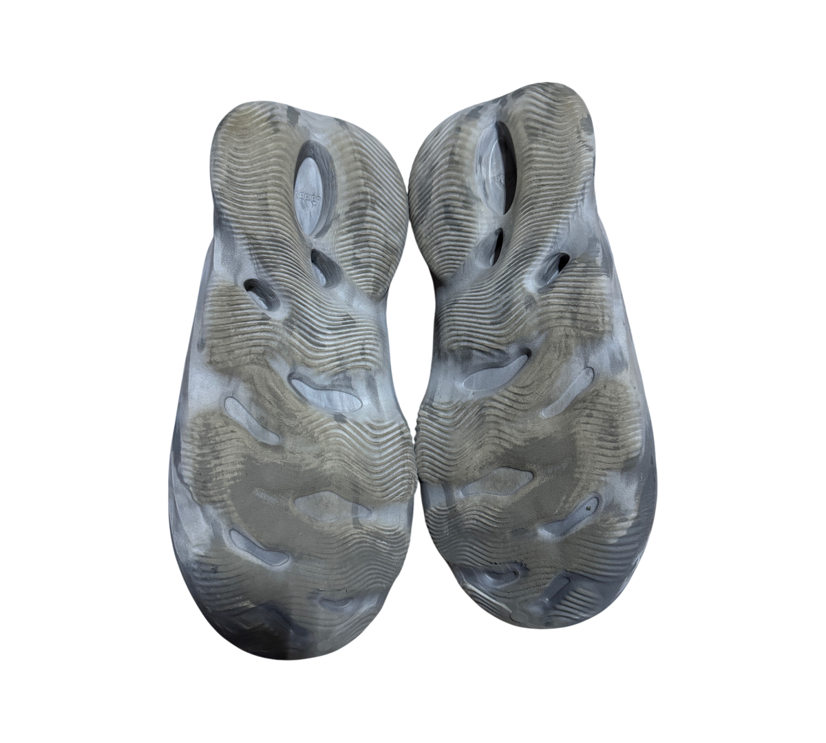 Genesis Boutique used Yeezy Foam Runner MX Granite slip-on shoes showing the textured grey marbled rubber outsoles