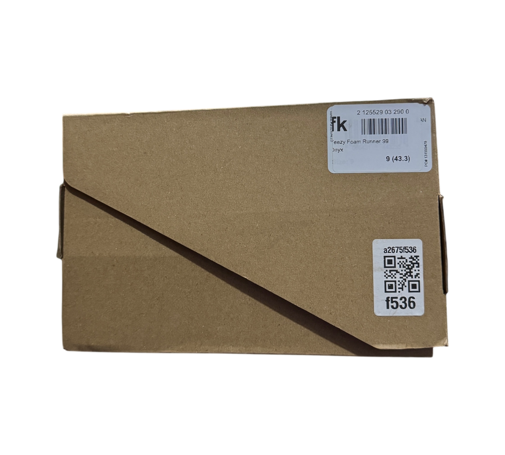 Genesis Boutique cardboard shoe box for Yeezy Foam Runner Onyx with inventory label in a warehouse setting