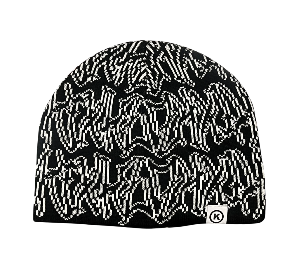 Genesis Boutique black knit beanie with a white abstract pattern and a small white tag with a black K logo.