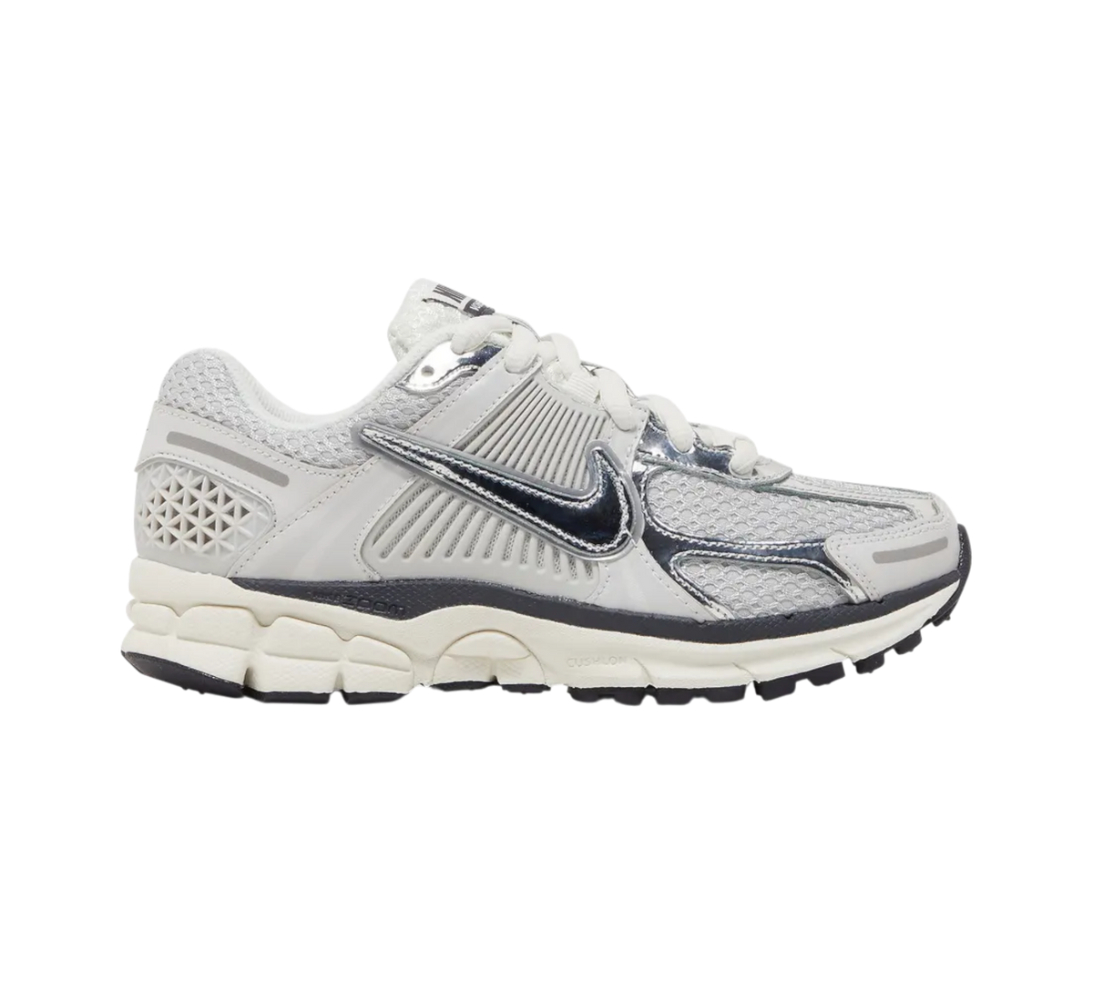 Genesis Boutique Nike Zoom Vomero 5 W "Metallic Photon Dust" women's athletic shoes with mesh and leather details in silver and white.